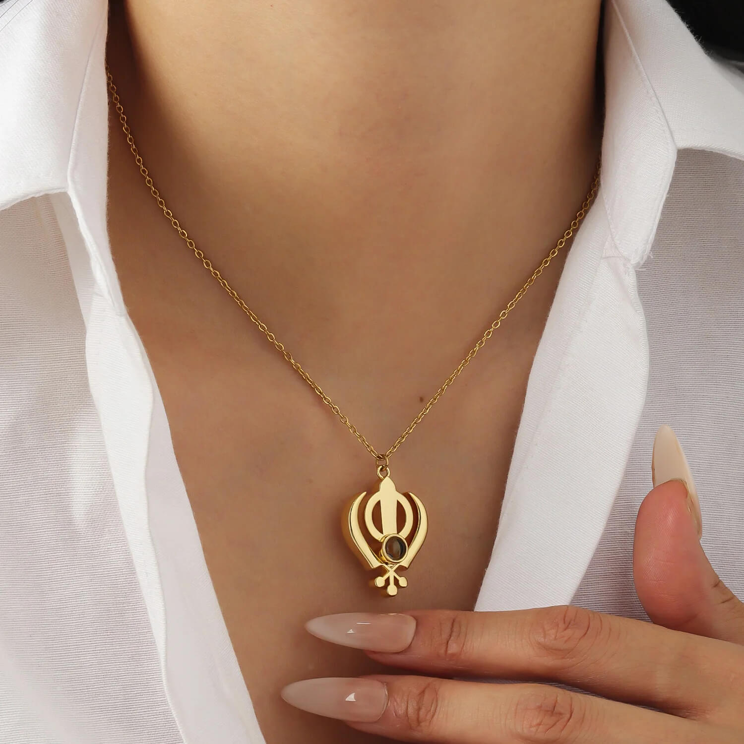 Gold 3D Khanda Pendant Necklace worn on neck, a meaningful Sikh jewelry piece with a customizable projection gem.
