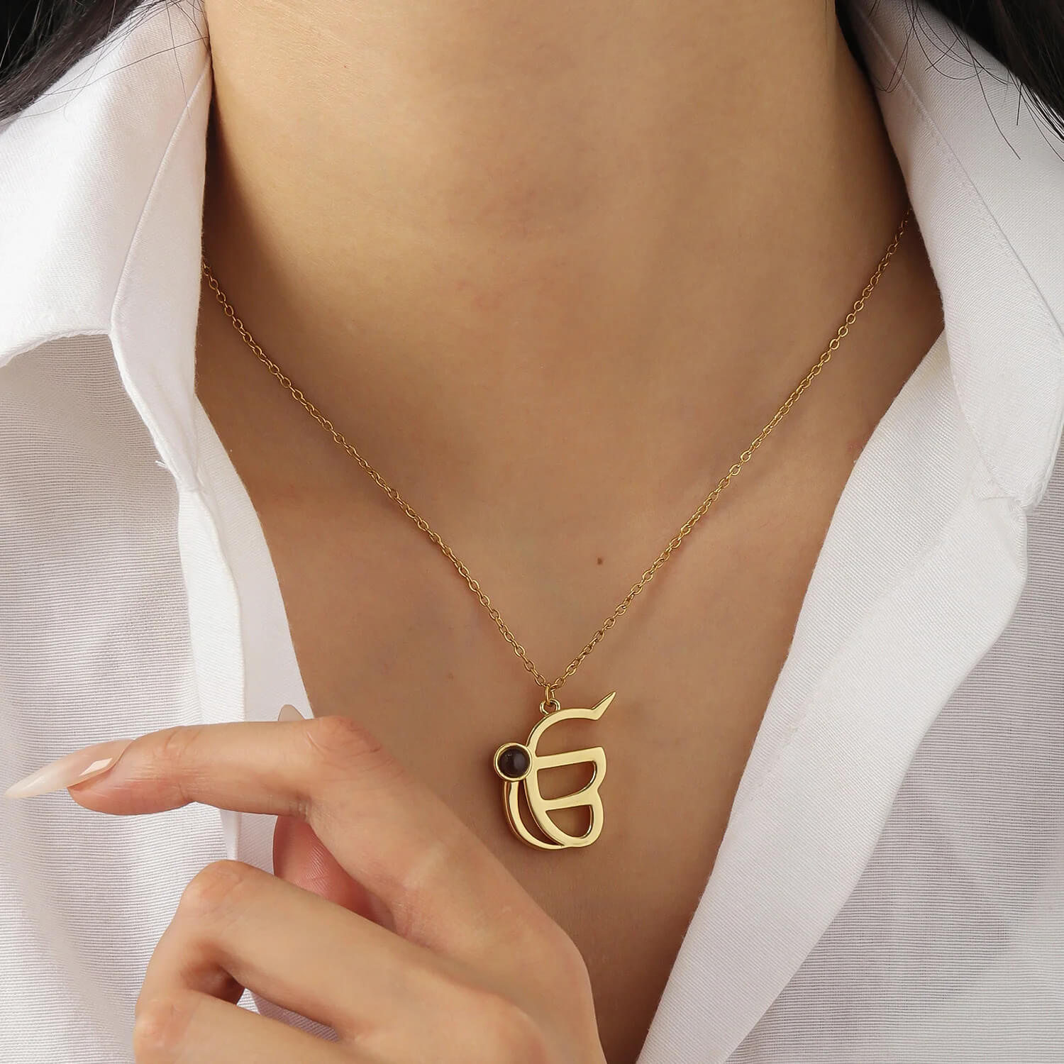 Model wearing gold 3D Punjabi Projection Necklace, highlighting the elegant and meaningful custom pendant.