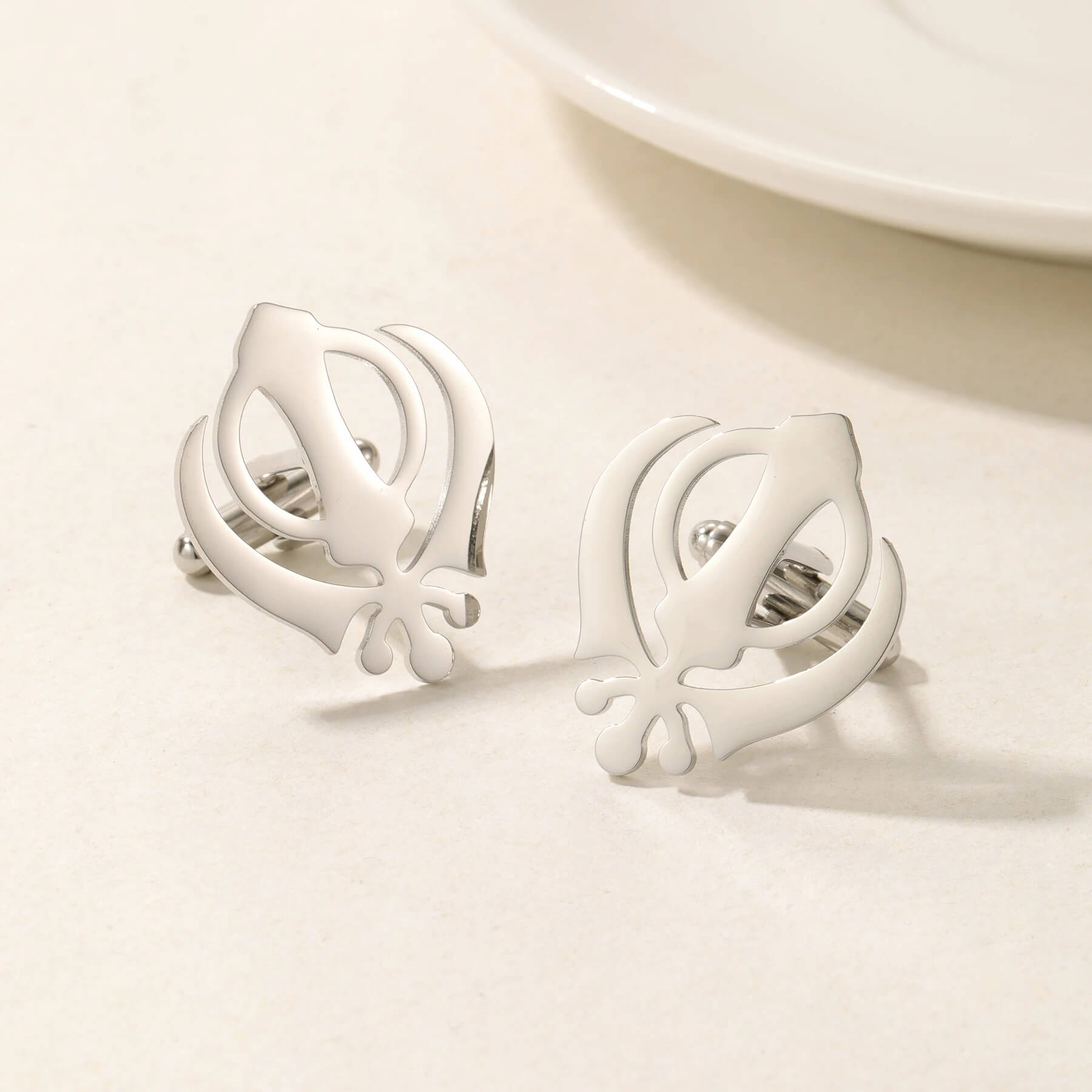Silver Punjabi Sikh cufflinks featuring the Khanda emblem in stainless steel, perfect for elegant men's religious jewelry.