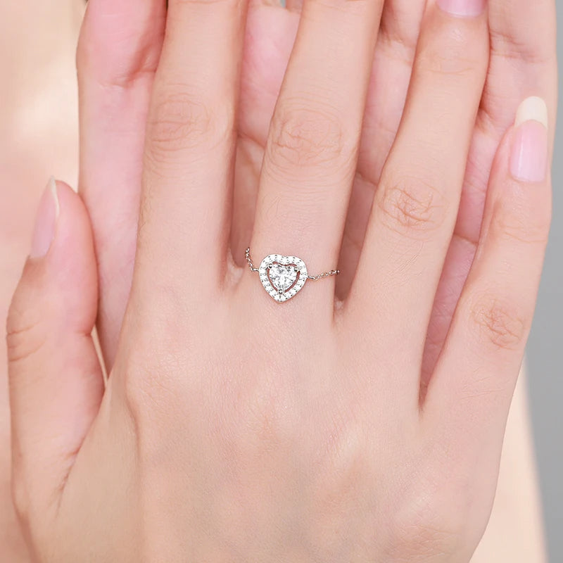 Self Love Chain Ring featuring a heart-link design in 925 sterling silver with sparkling cubic zirconia, worn on a hand.