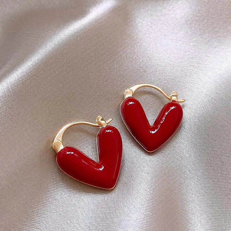 Antique Love Hearts Hoops with rich red enamel heart charms on sleek metal hoops, elegant and nostalgic.