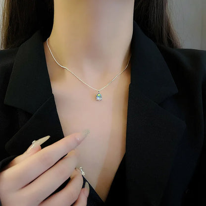 Model wearing Tear Drop Zircon Necklace, showcasing its elegant design and sparkling zircon pendant.