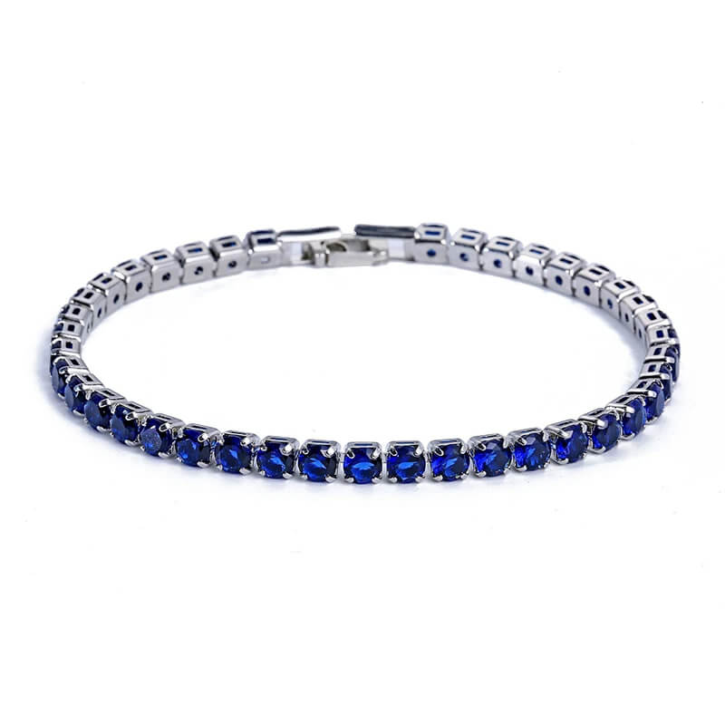 Royal blue iced out tennis bracelet with deep blue zirconia stones, bold hip hop jewelry for men and women.
