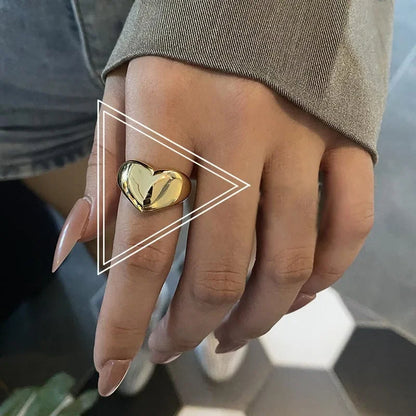 Hand wearing the Lustrous Heart Ring in 18K Gold Vermeil, showcasing its elegant design and adjustable fit.