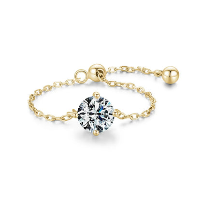 Elegant gold chain ring featuring a sparkling round zircon stone, symbolizing strength and individuality.